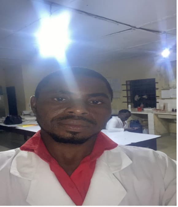 Mr. Elvis, Medical Laboratory technician and community focal point, working with TRACH