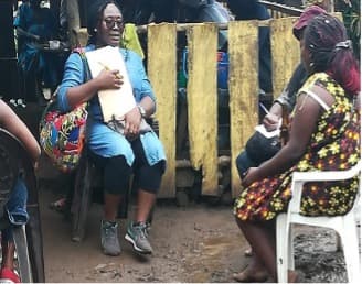 TRACH team member conducting community interview with local woman